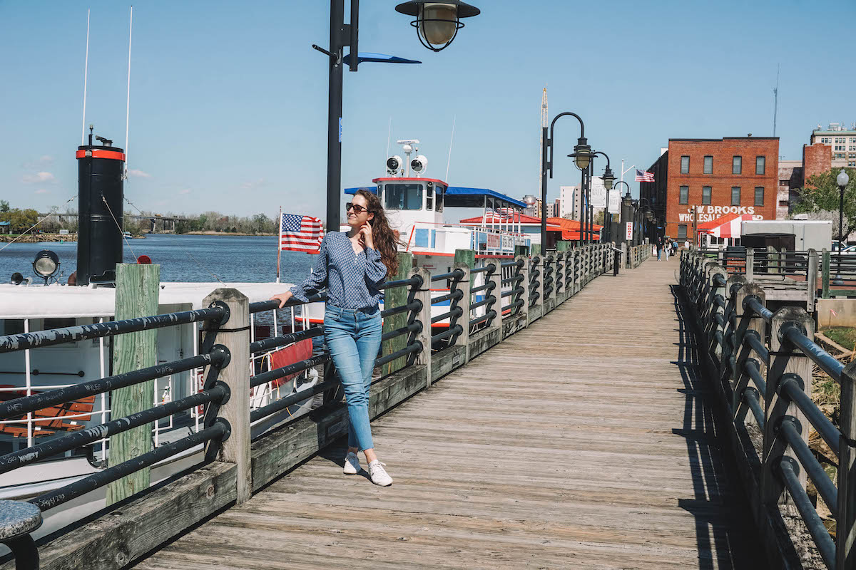 Woman posing on Wilmington River Walk on a sunny day. 