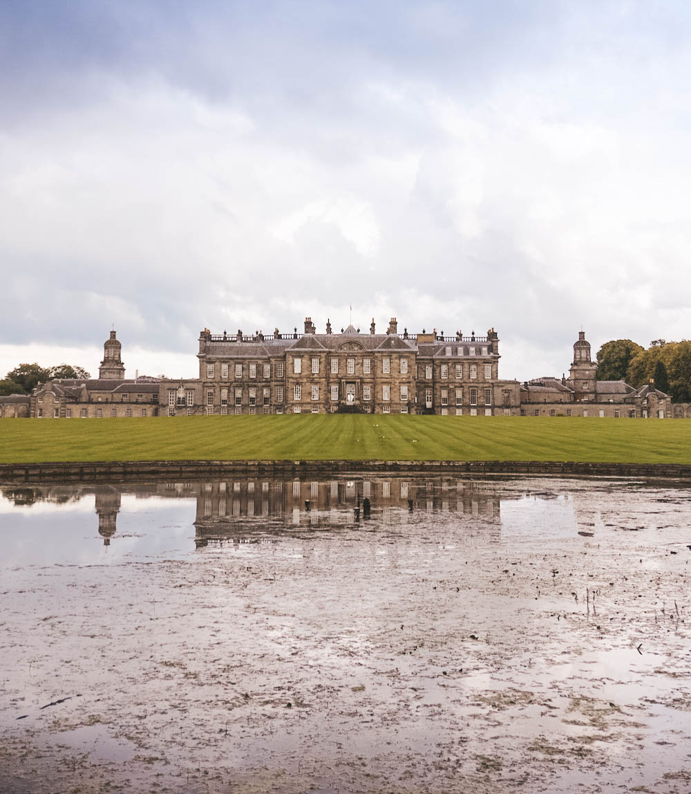 A pond, with Hopetoun House in the background. 