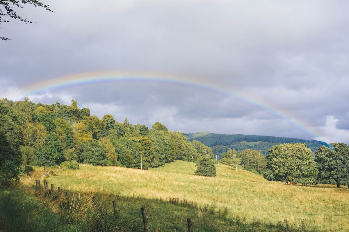A rainbow over the countryside of Inveraray Scotland. 