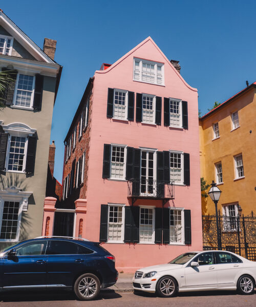 Three pastel-colored houses along Charleston's Rainbow Row.