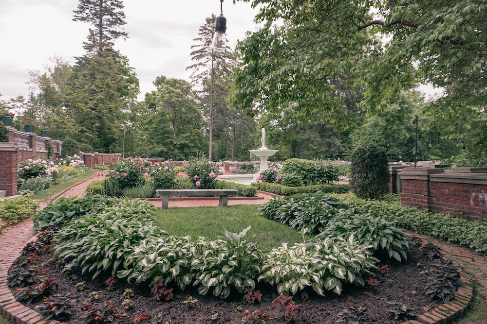 View of the formal gardens at Glensheen Mansion, seen from the side. 