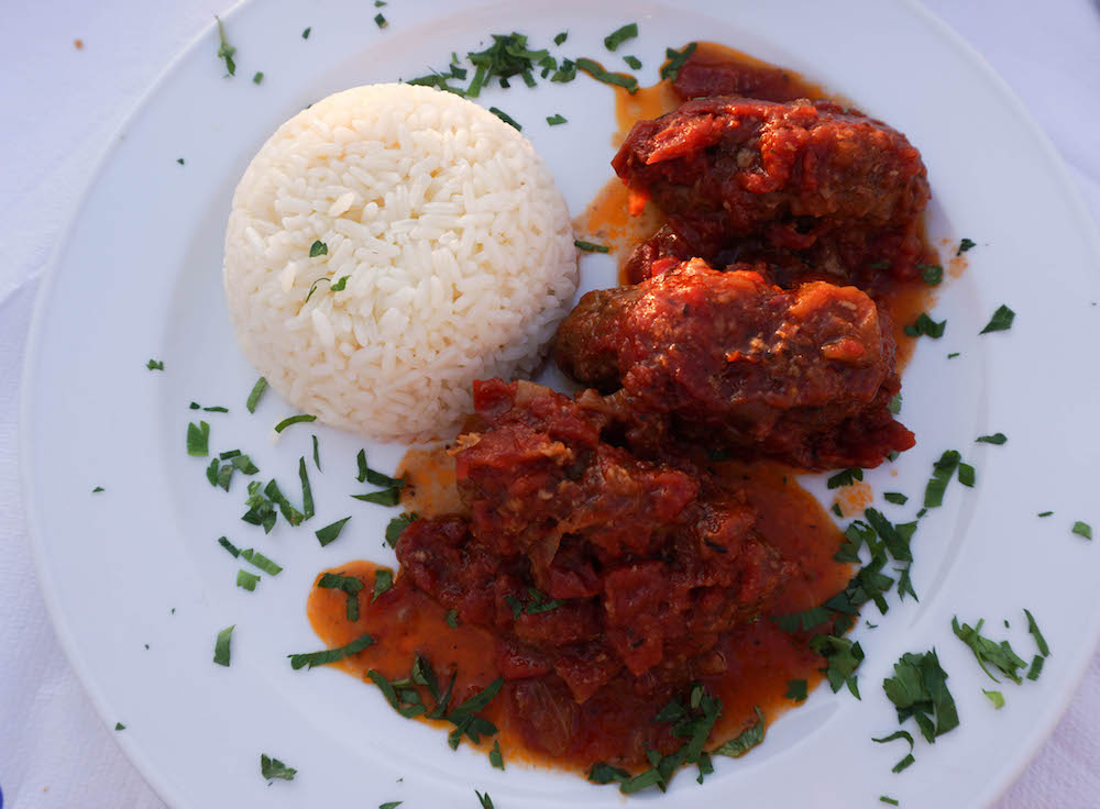 Overhead view of Greek meatballs and rice. 