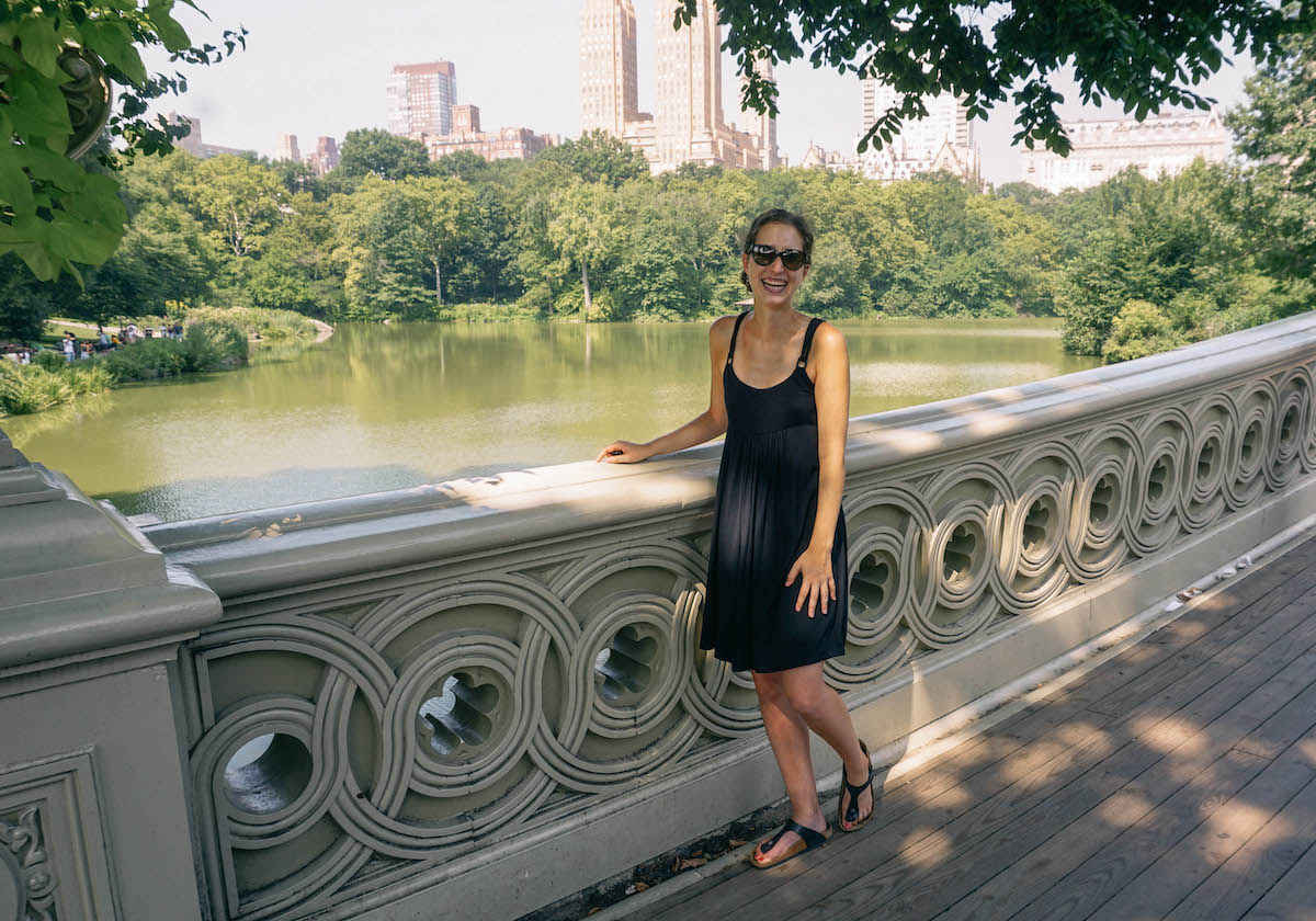 Woman standing on Bow Bridge in Central Park