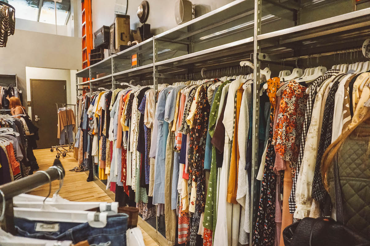 Inside a thrift store, at the women's section