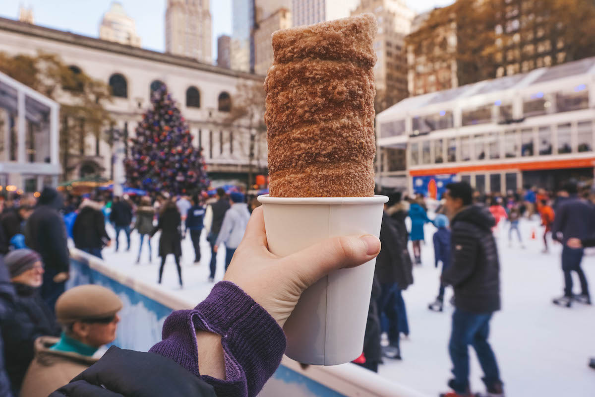 Chimney cake being held aloft at the Bryant Park Winter Village. 