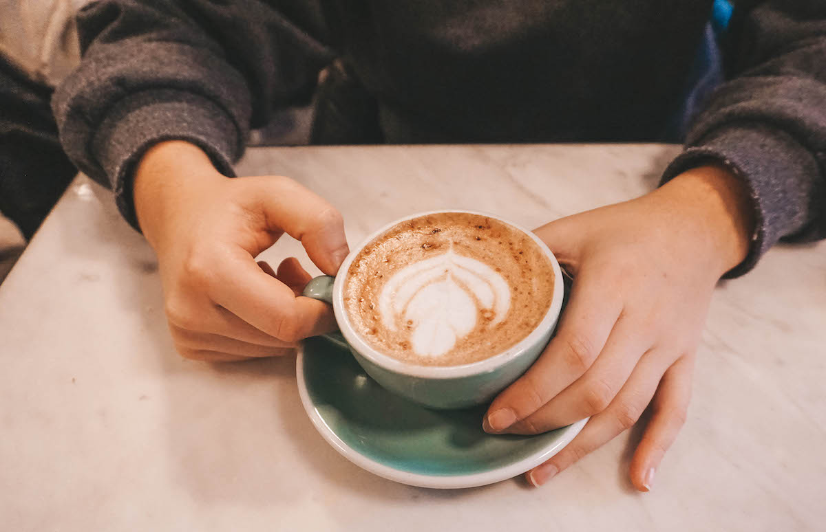 Female hands holding a mug of hot chocolate. 