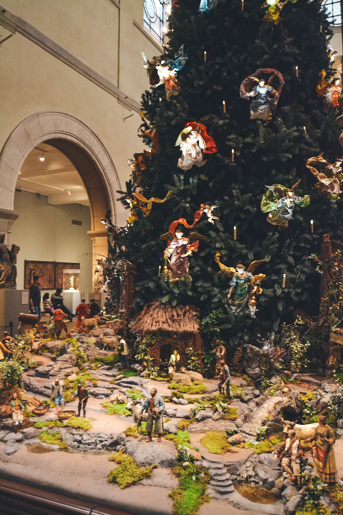 Close up view of the nativity set up beneath the Met Museum Christmas tree in NYC.