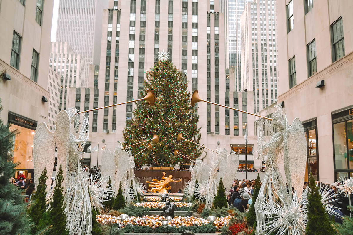 View of the Rockefeller Center Christmas Tree, seen through angel decorations. 