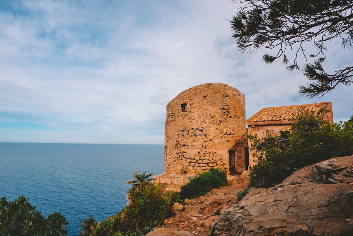 An abandoned watchtower along a hiking path near Sant Elm.