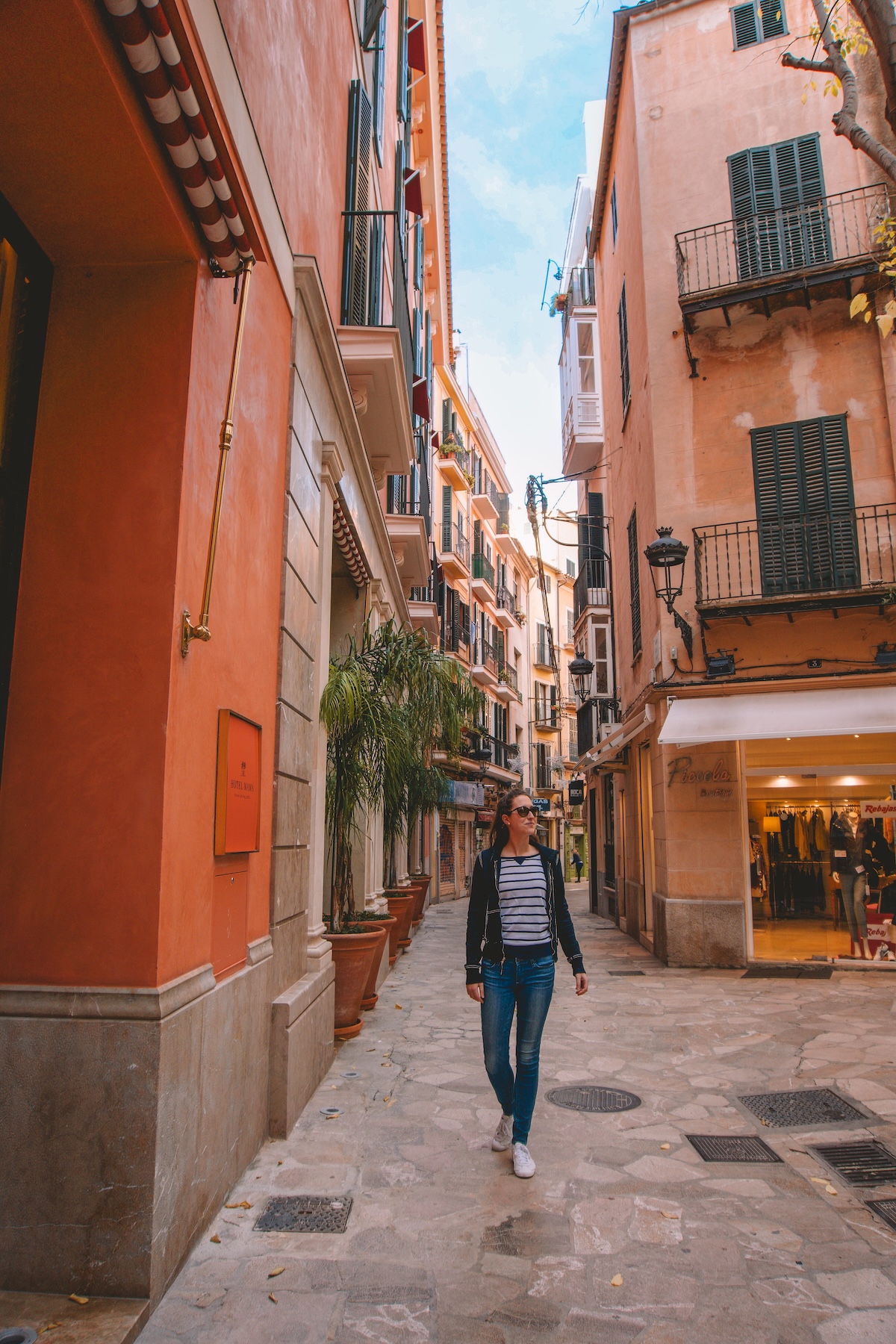 A woman standing in Palma's Old Town