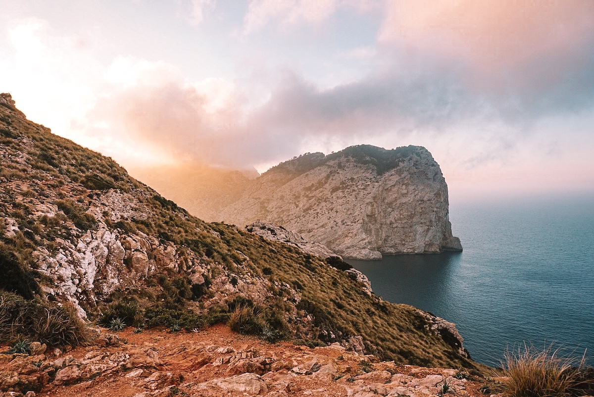 A foggy sunset view from the Cap de Formentor Lighthouse.