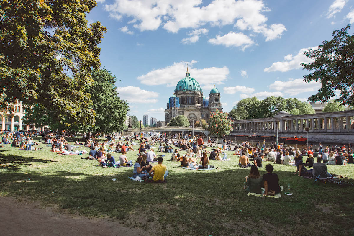 People gathered in Monbijoupark on a sunny day.