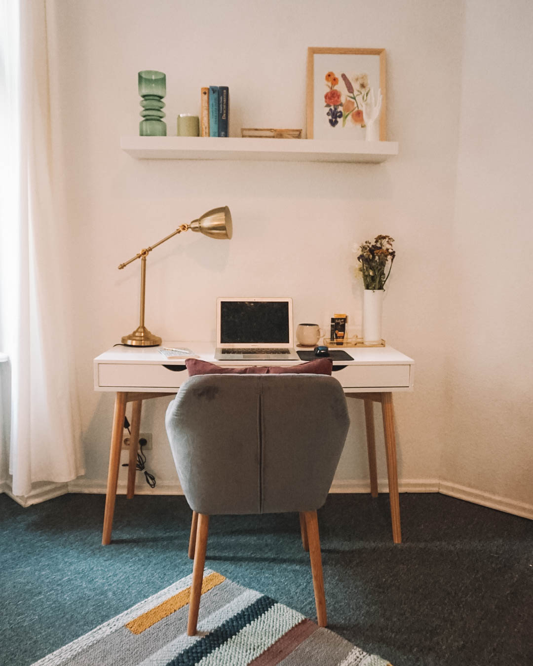 view of white desk with purple armchair in front of it