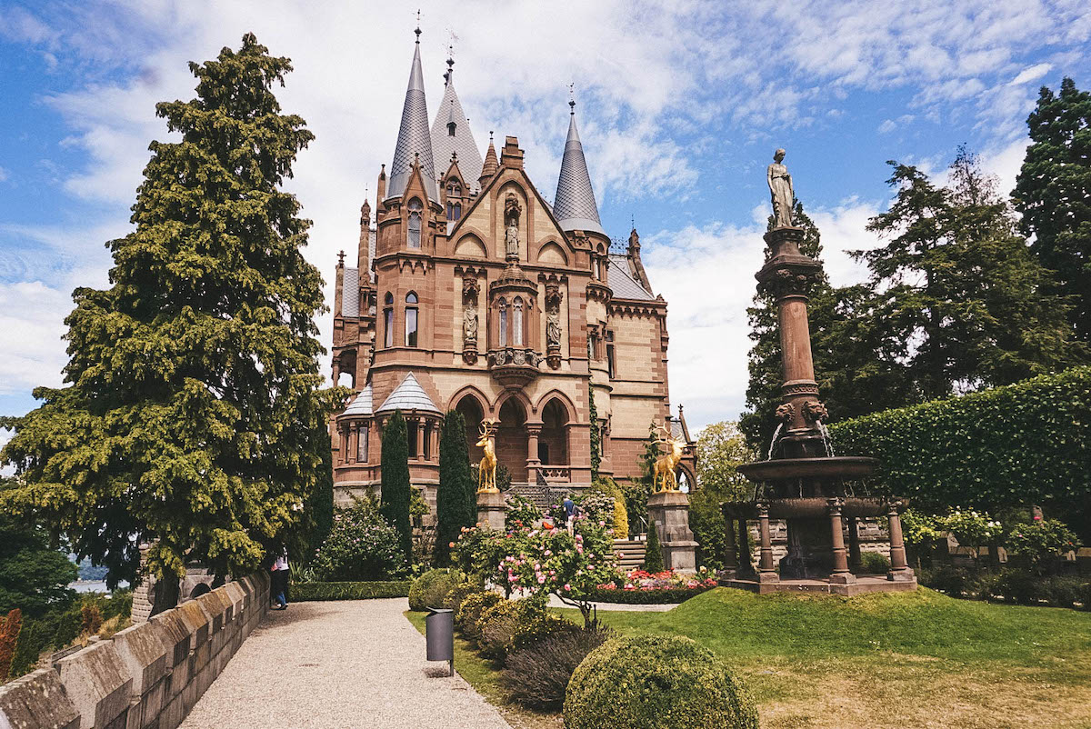 Drachenburg Castle, seen from its garden on a sunny day