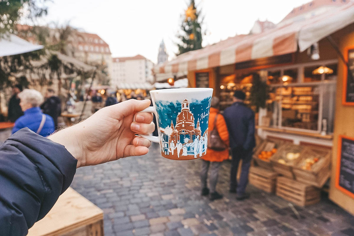 A mug being held aloft at a Christmas market in Dresden, Germany