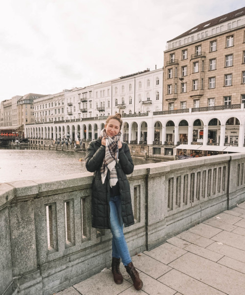 Woman standing on bridge in Hamburg Germany's Old Town.
