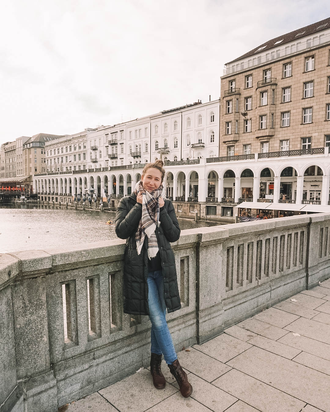 Woman standing on bridge in Hamburg Germany's Old Town.