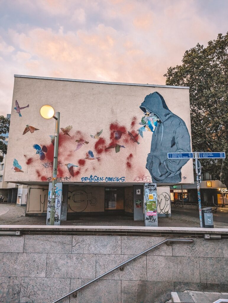 A mural covering the side of a building in Berlin