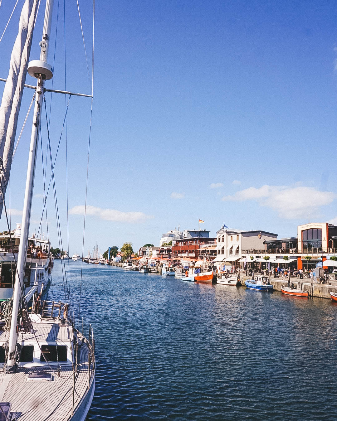 Port of Warnemünde, with boats moored along the sides.