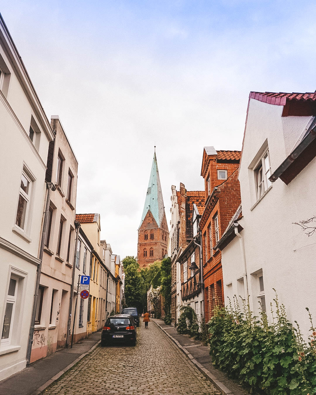 Side street in Luebeck Germany with St. Giles' church in the background. 