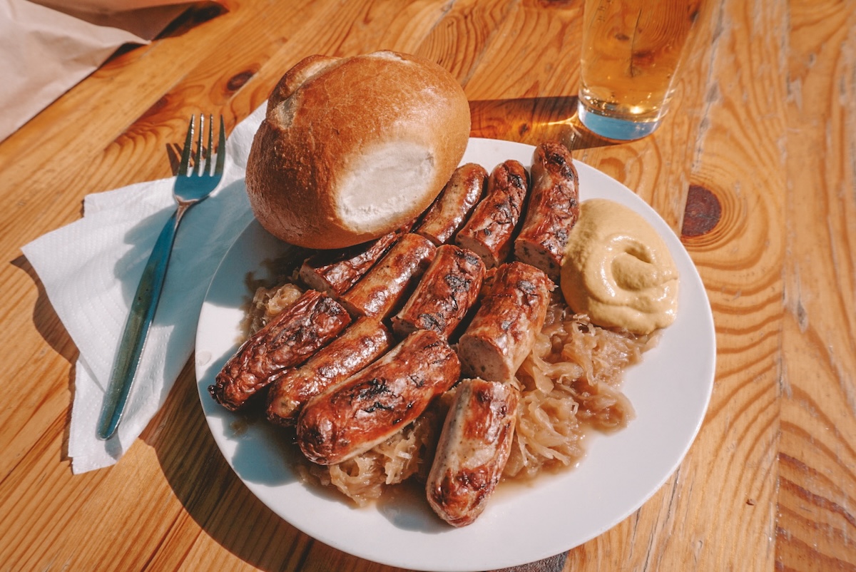 A plate of bratwurst and sauerkraut