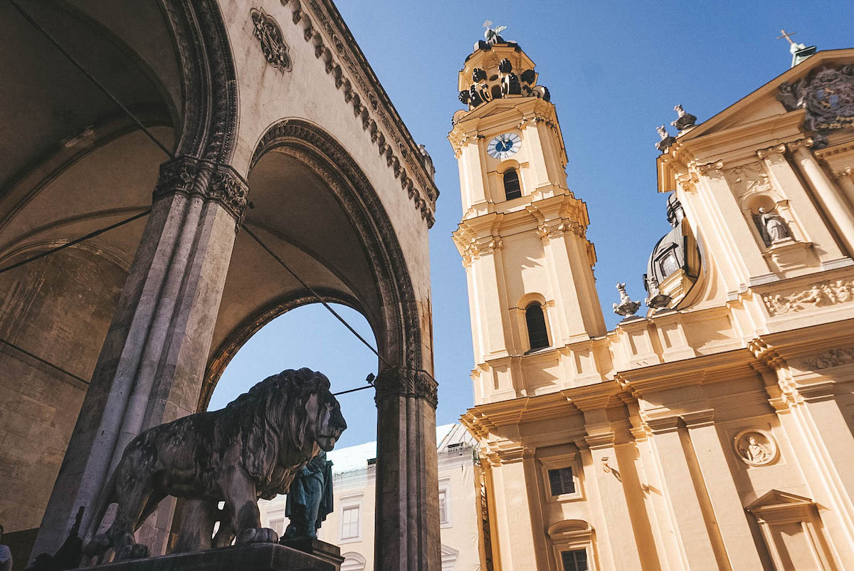 A view upwards towards the yellow facade of the Theatinerkirche in Munich 