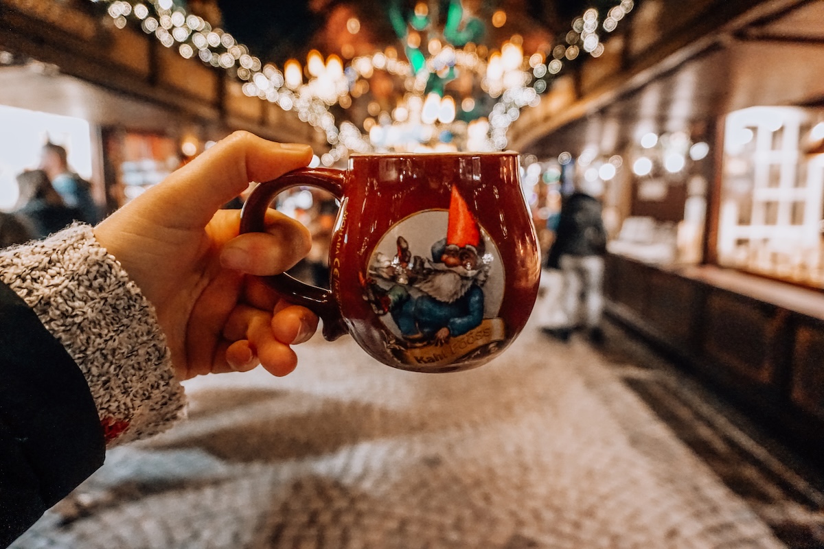 A mug held aloft at a Christmas market in Cologne