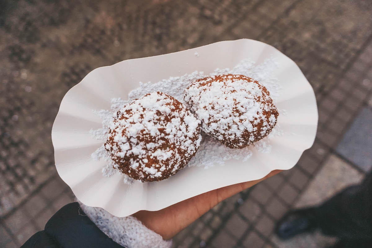 Two quark balls dusted with powdered sugar on a paper plate