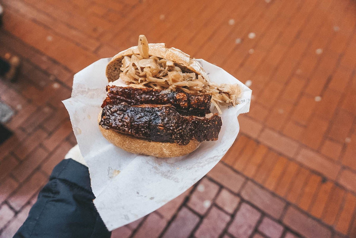 Spießbraten on a roll with sauerkraut 