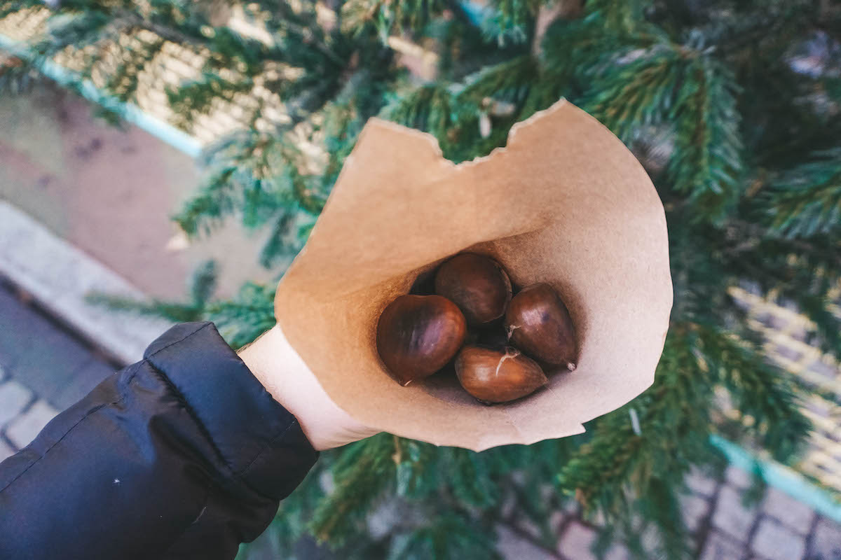 Roasted chestnuts in a brown paper bag