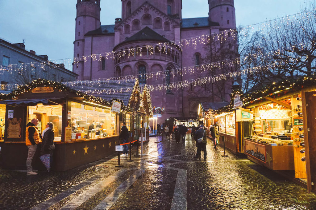 Mainz Cathedral at night with Christmas market in foreground