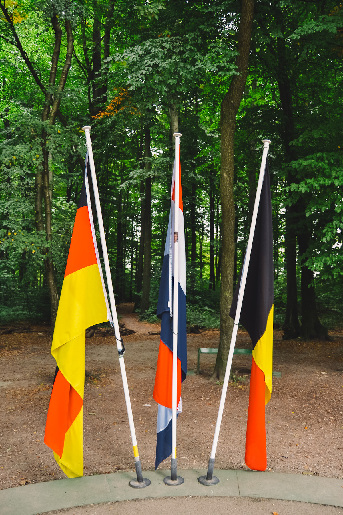 The flags of Germany, the Netherlands, and Belgium at the Three Country Point. 