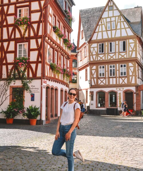 A woman smiling in the Kirschgarten in Mainz.