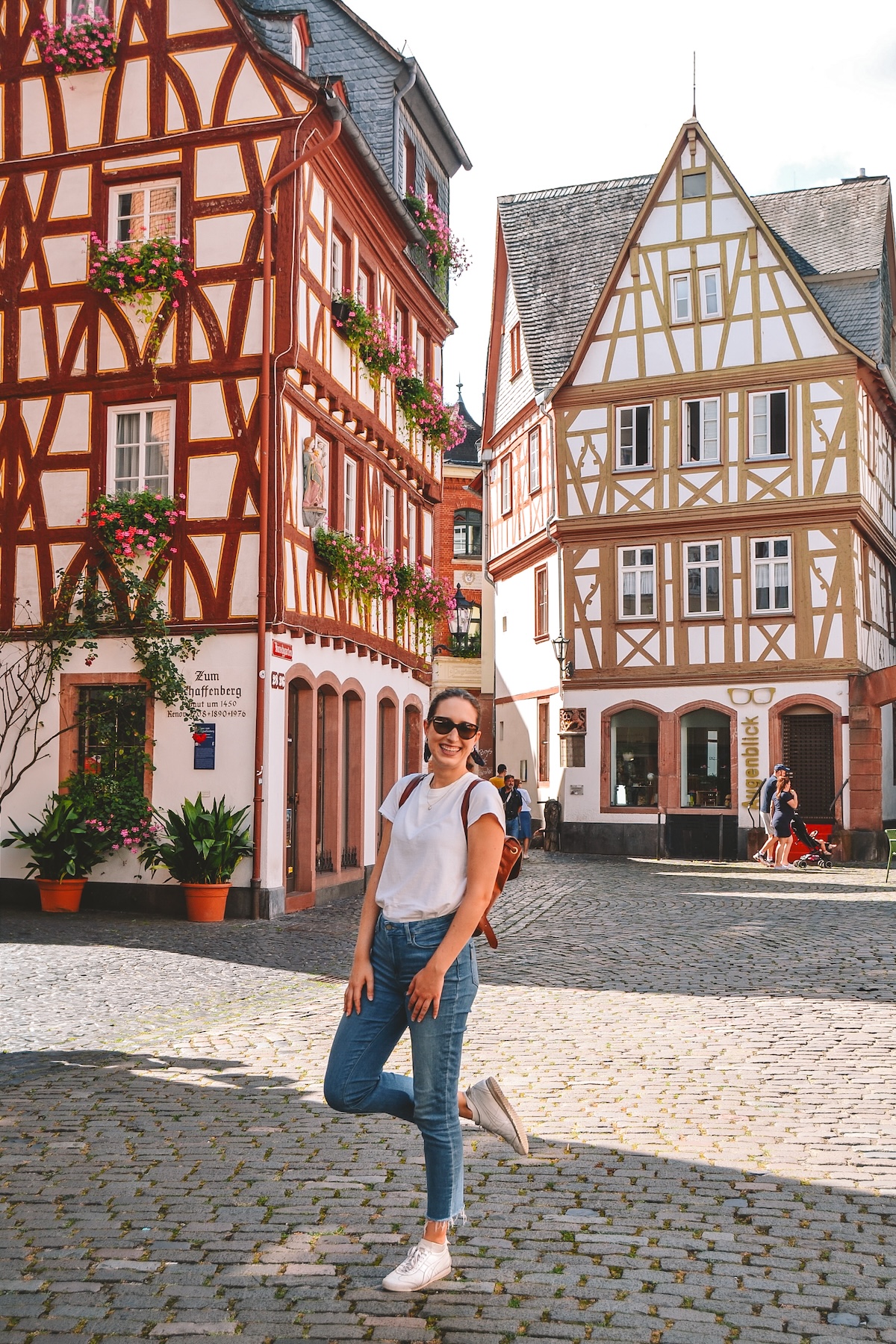 A woman smiling in the Kirschgarten in Mainz.