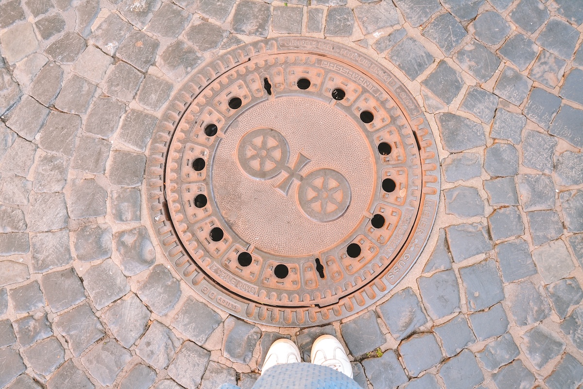 The Wheel of Mainz, shown on a manhole cover.