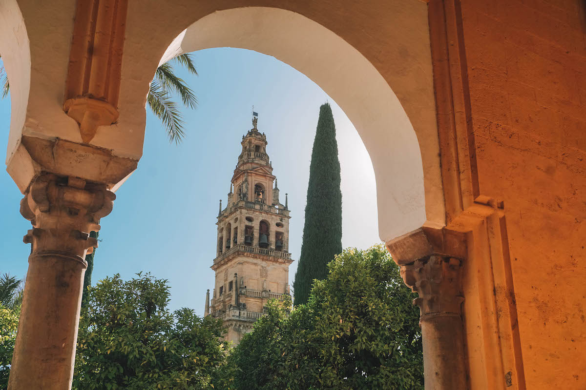 The bell tower of Cordoba's Mezquita, seen through an archway. 