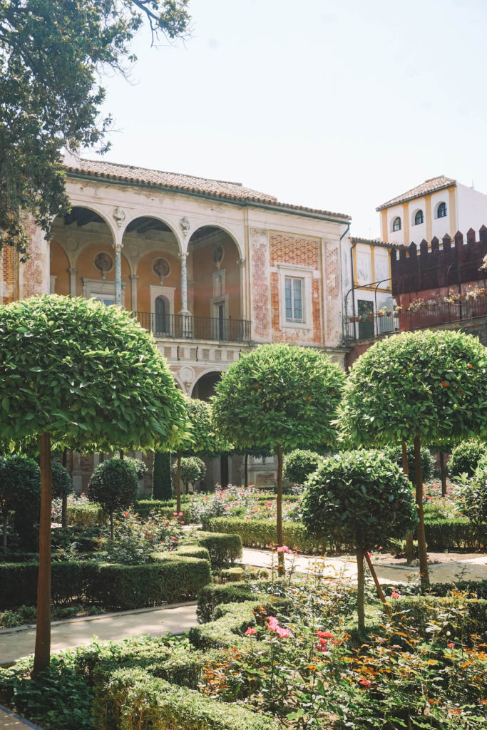 A lush patio within the Casa de Pilatos.