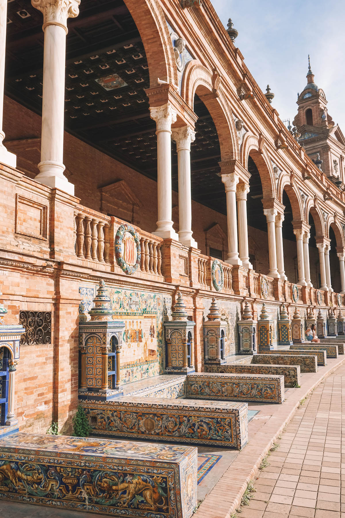 A row of tiled benches along the edge of the Plaza de Espana in Seville, Spain.