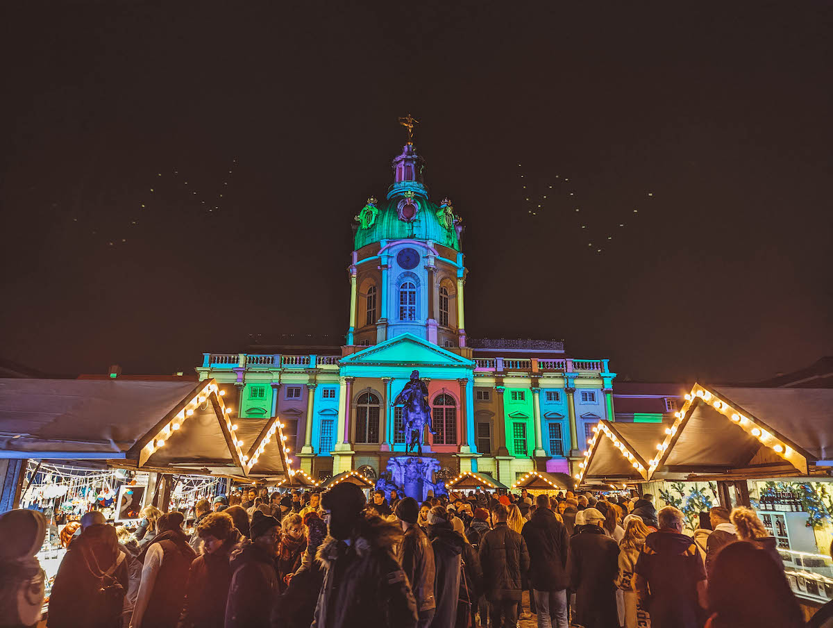 The Charlottenburg Palace Christmas Market, lit up at night. 