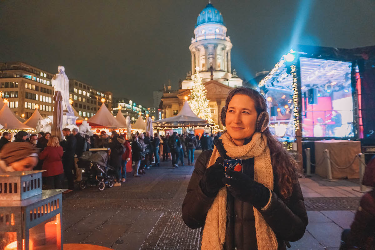 Woman holding mulled wine at Christmas market