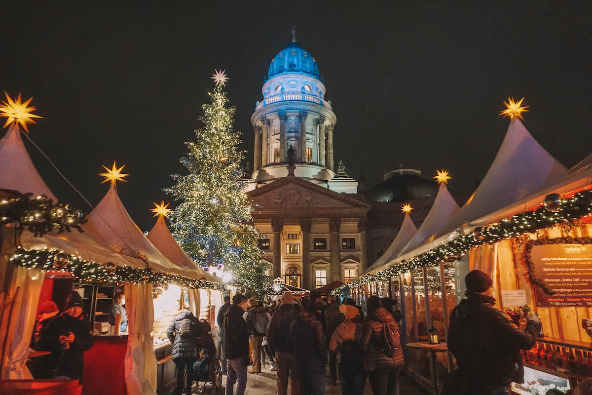 Gendarmenmarkt Christmas market at night, with the tree lit up
