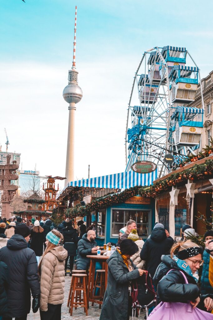 Ferris wheel at Humboldt Forum Christmas market, with TV tower in background
