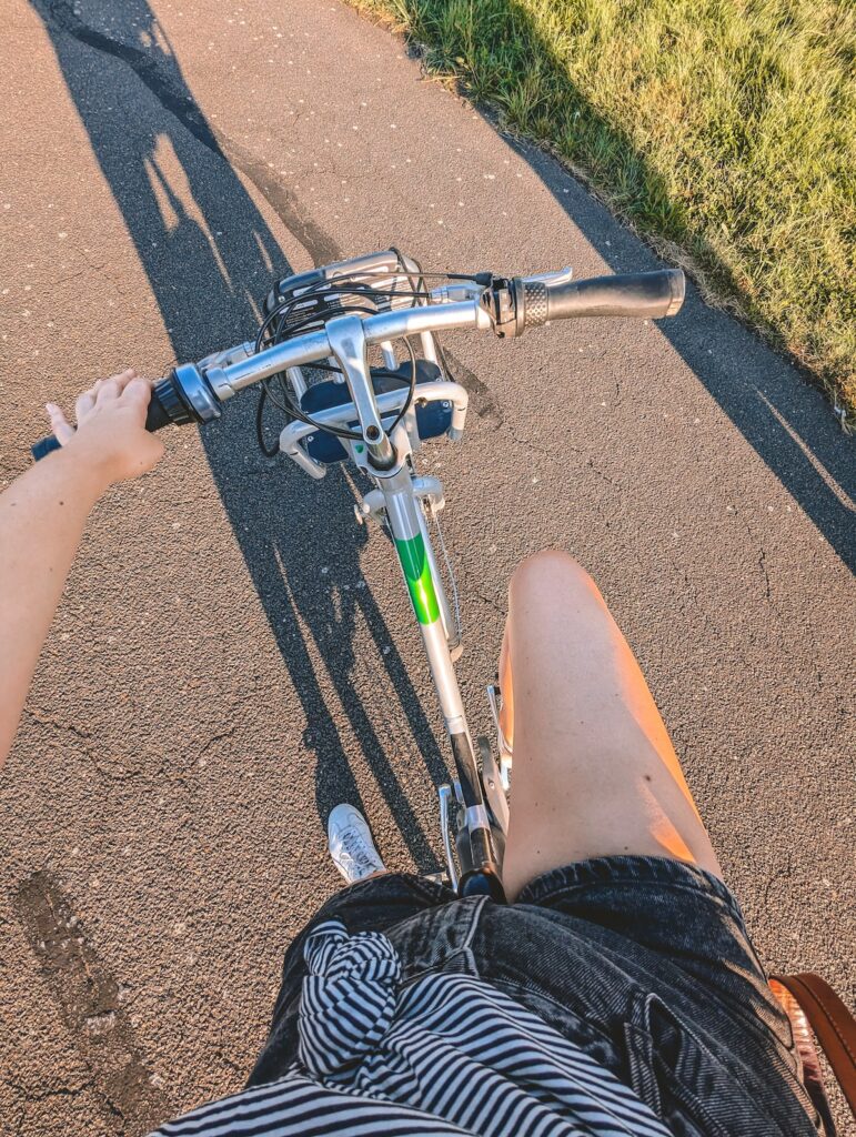 View down at a woman biking