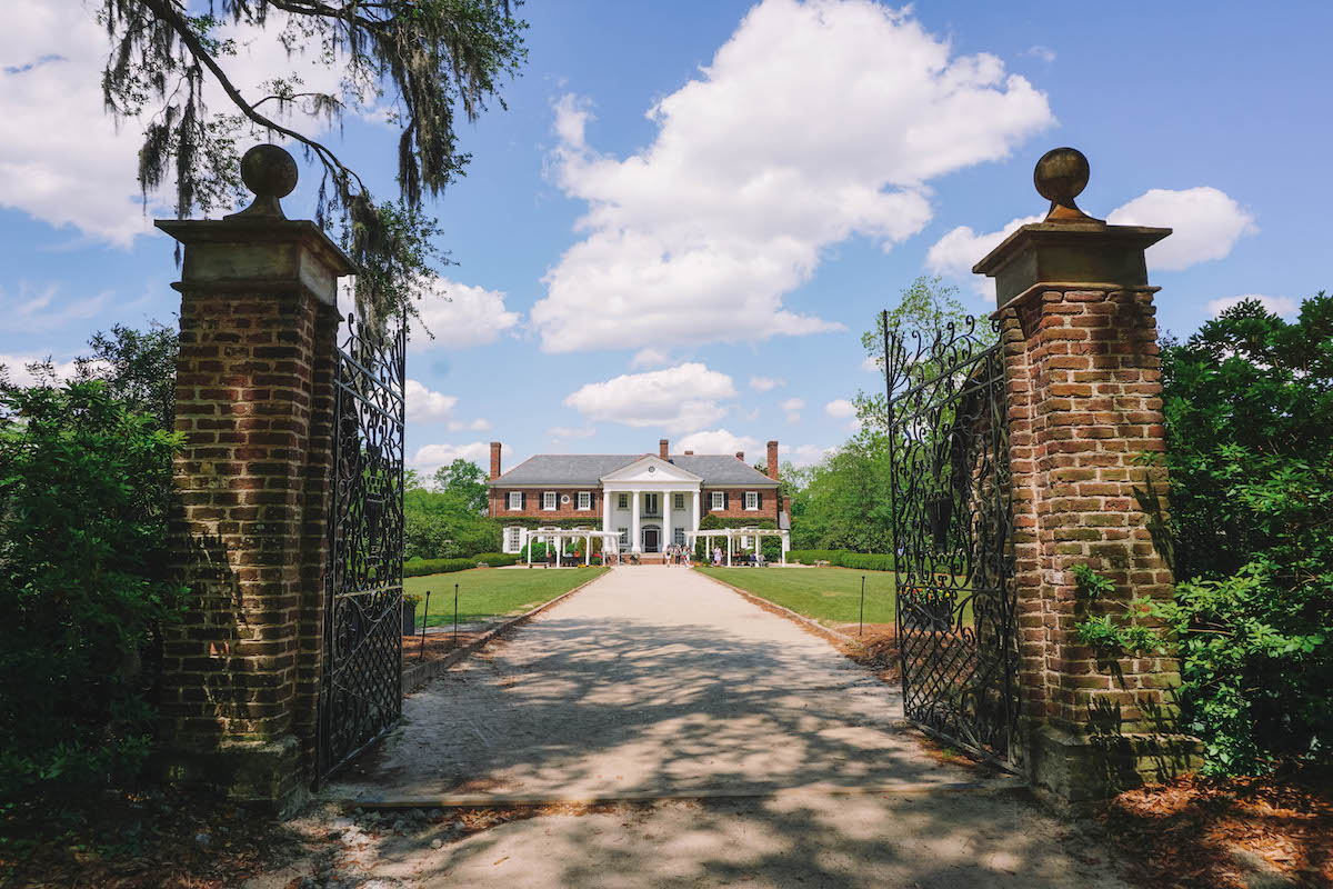The front gate of Boone Hall plantation, with the house in the background 