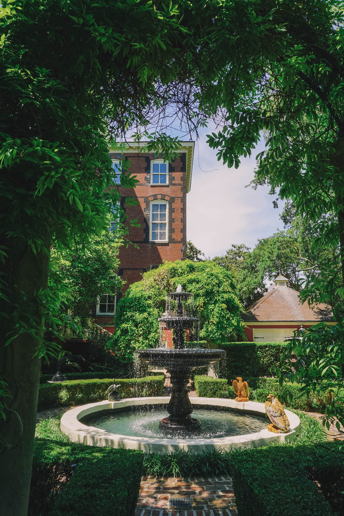 A fountain amongst the foliage of the back garden of the Williams Mansion in Charleston