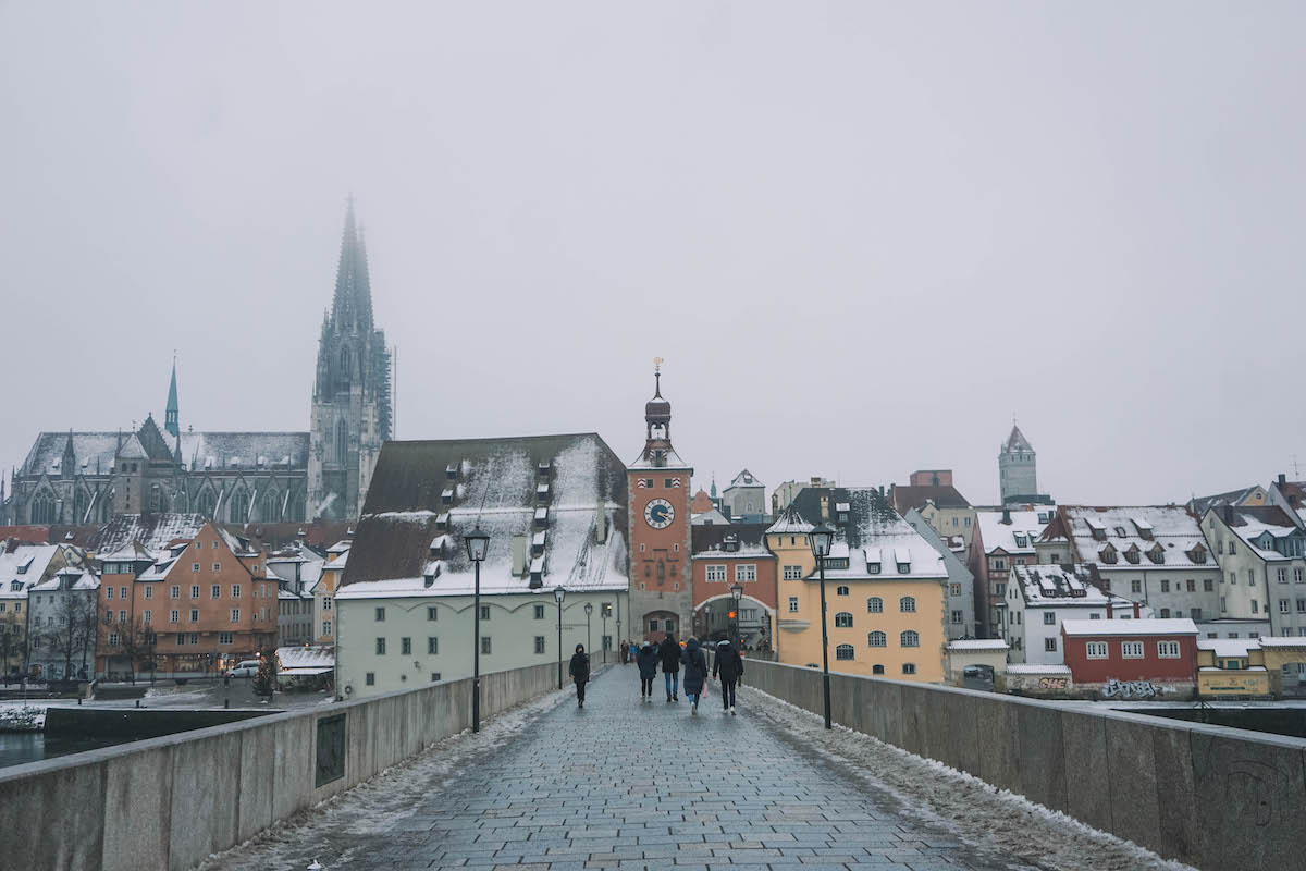 The old bridge in Regensburg, Germany on a foggy day.