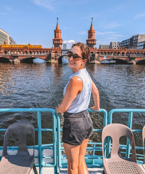 Woman smiling on Spree river boat cruise.