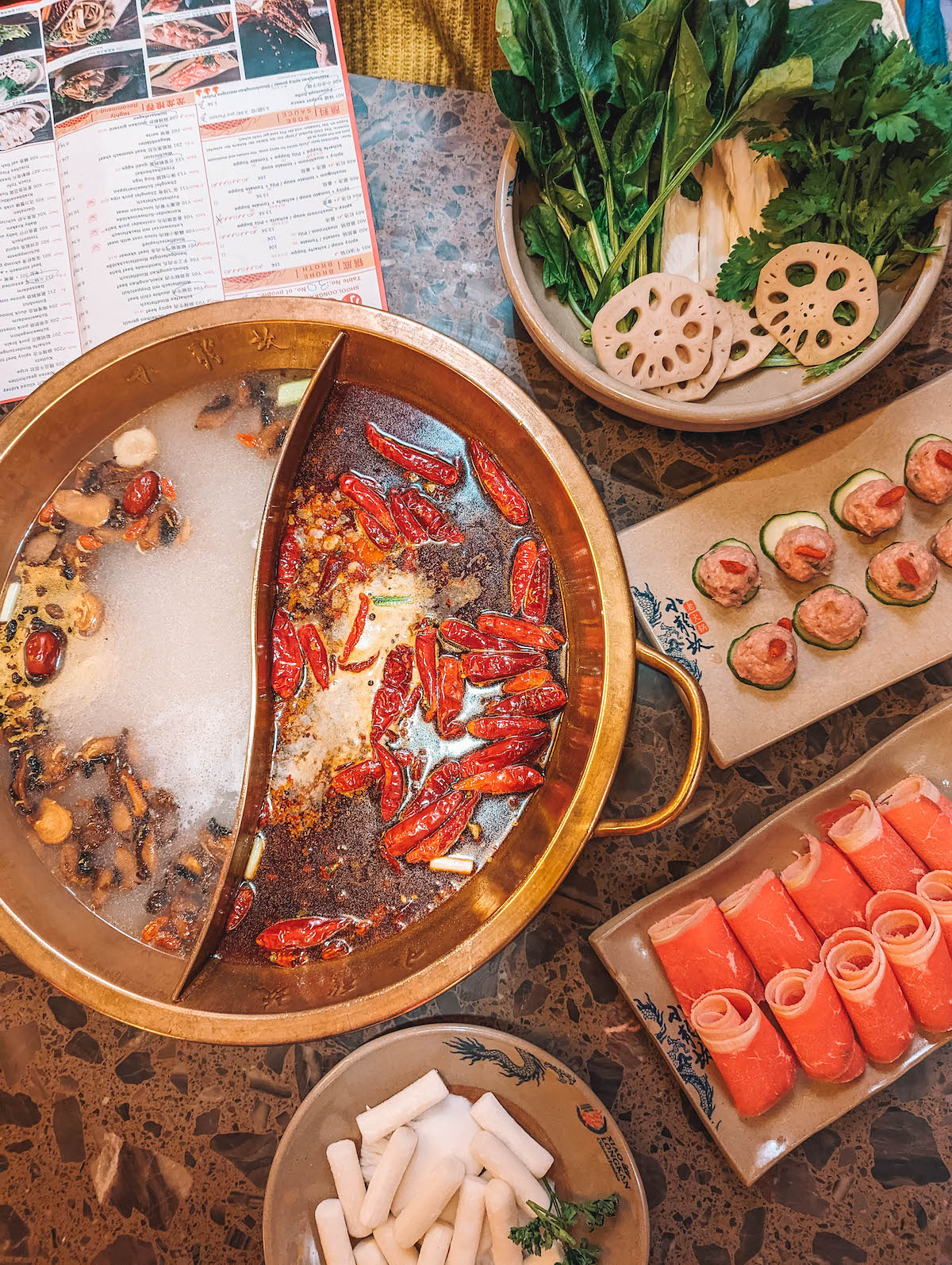 An overhead view of a hot pot dining experience 