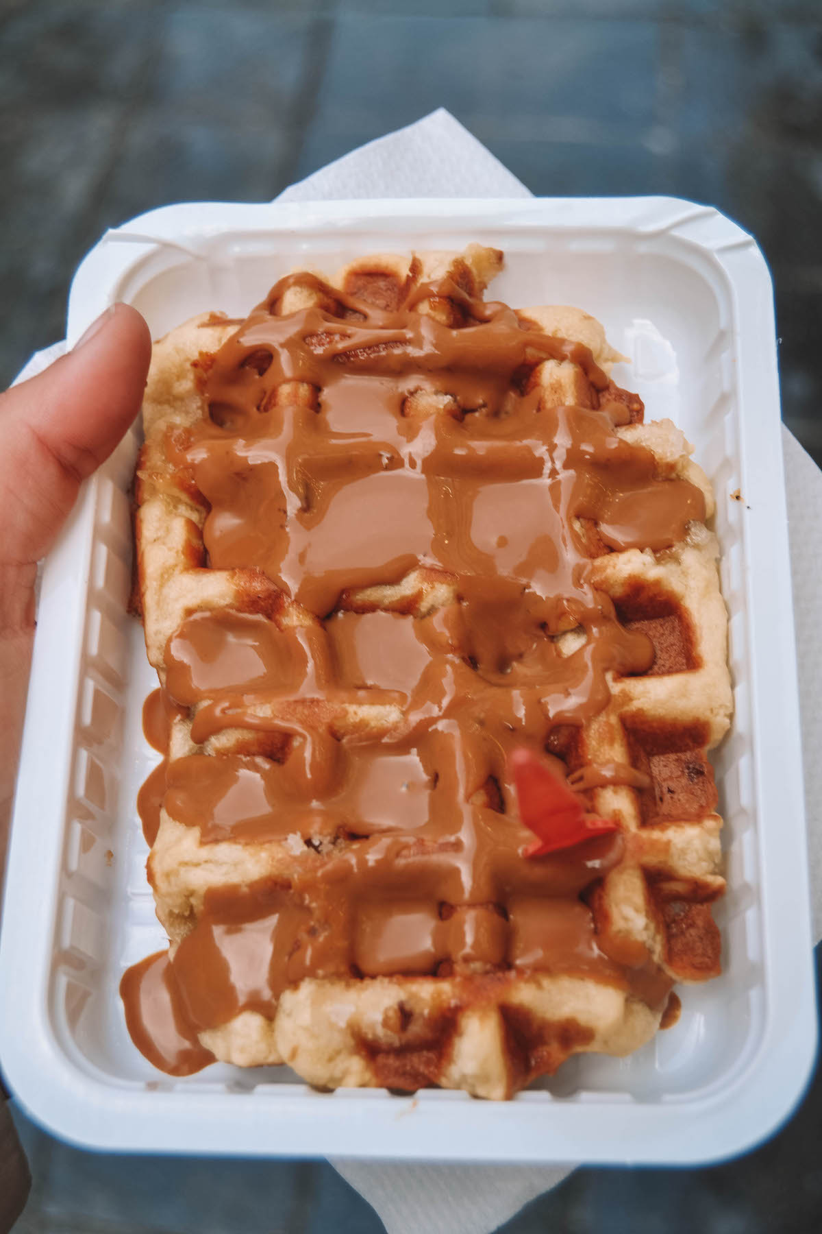 A Belgian waffle drizzled with Biscoff spread