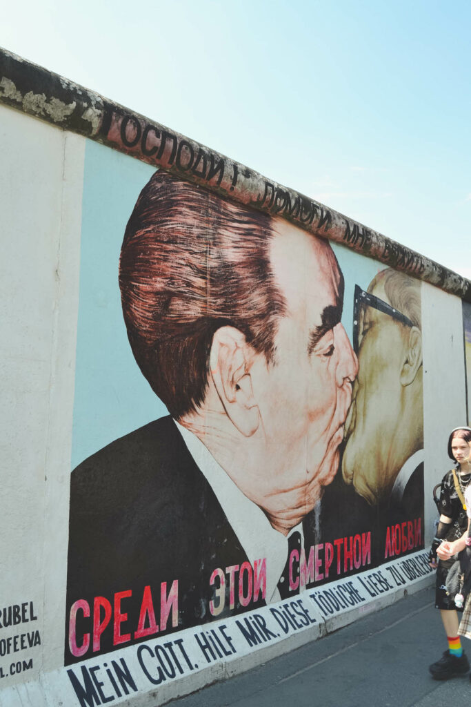 Famous kissing scene at East Side Gallery in Berlin. 